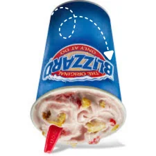 Dairy Queen Dipped Strawberry Cheesecake Blizzard Treat with strawberry sauce and cheesecake chunks