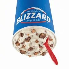Dairy Queen Heath Blizzard Treat with chopped Heath toffee bar pieces and caramel swirls in soft serve