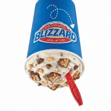Dairy Queen Heath Blizzard Treat with chopped Heath toffee bar pieces and caramel swirls in soft serve