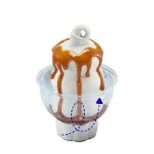 Dairy Queen Caramel Sundae with warm caramel sauce poured over creamy vanilla soft serve